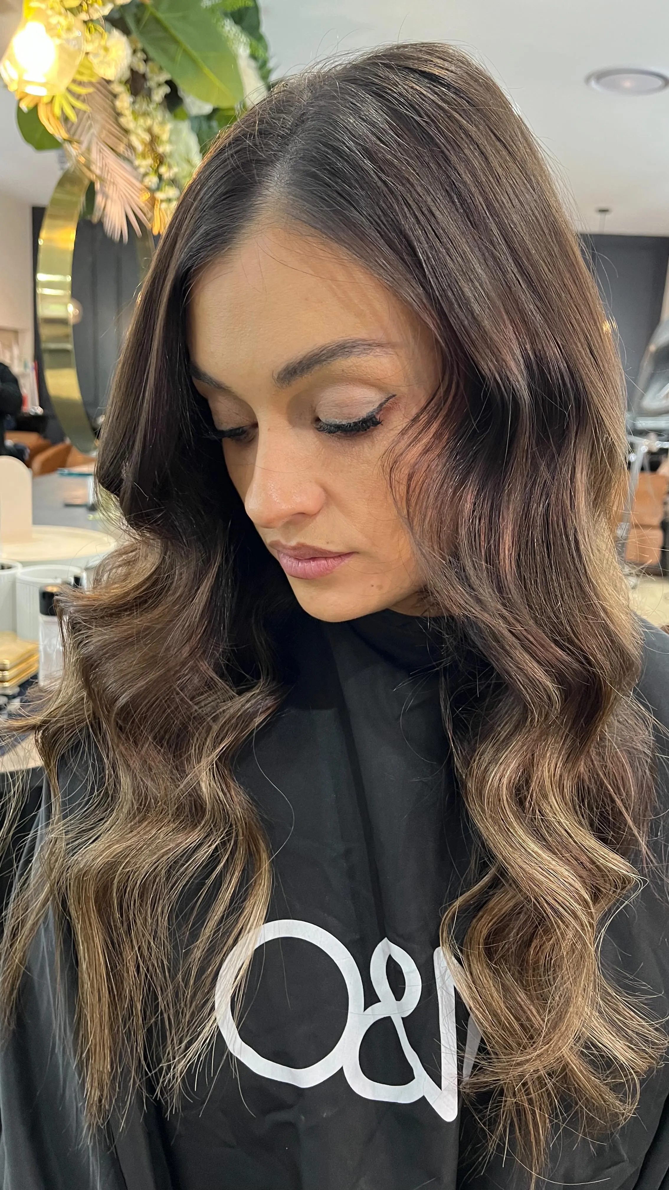 Glossy face-framing brunette cut styled with soft waves at Runway Tamworth