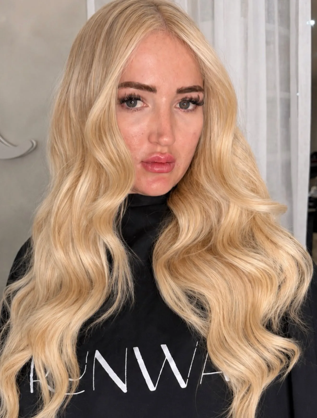 Long blonde hair extensions blended by a Runway stylist in Tamworth