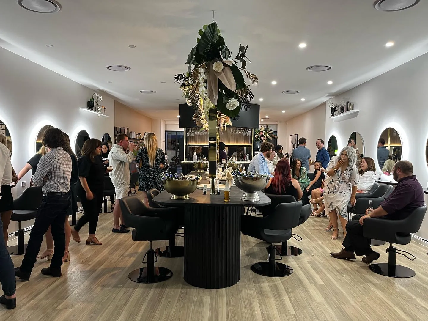 Styling chairs and arched mirrors inside Runway, a luxury hair and beauty salon in Tamworth