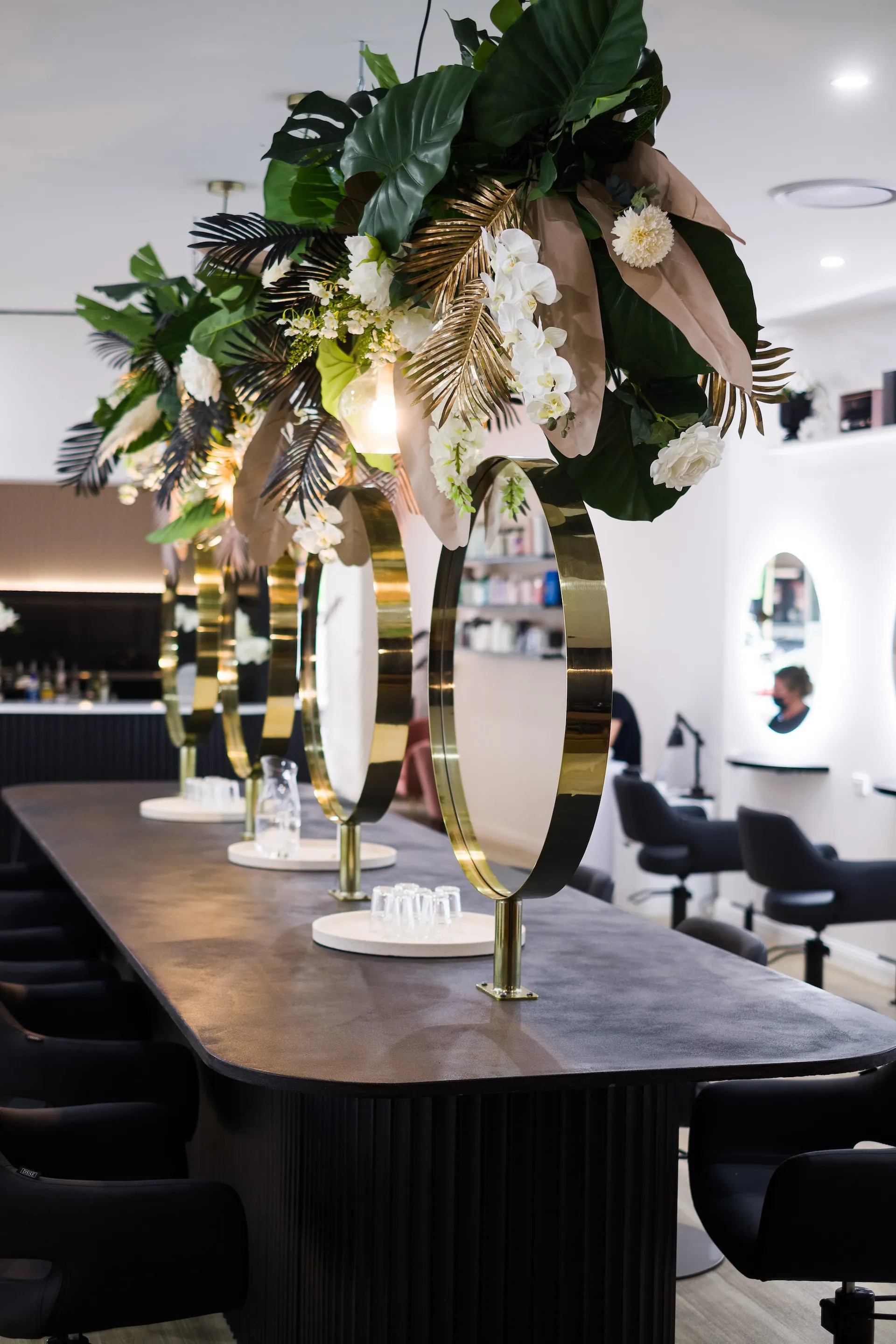 Arched mirrors and styling chairs inside Runway, Tamworth